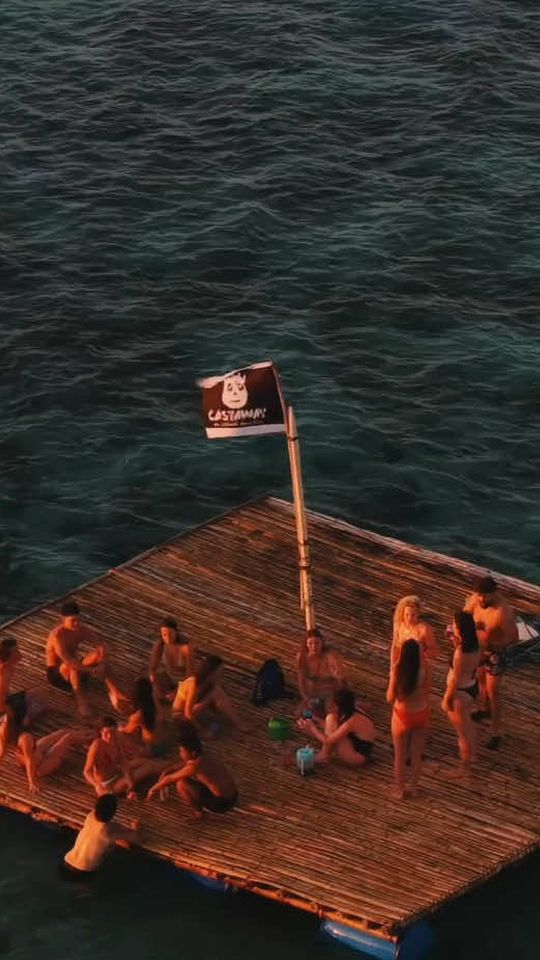 Guests watching the sunset from a floater with thirteen new friends on the expedition